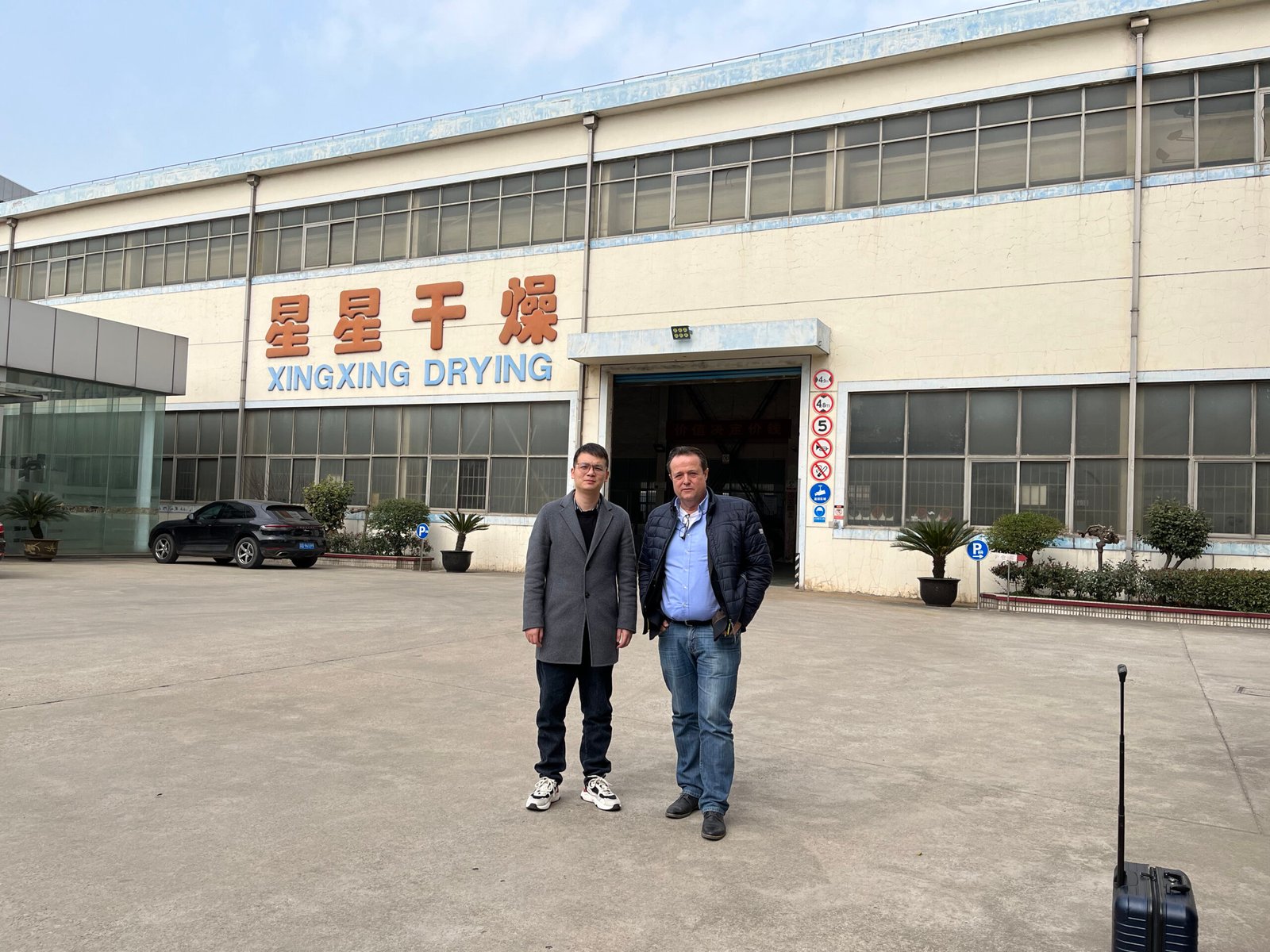 Australian client observing material testing process for custom drying system