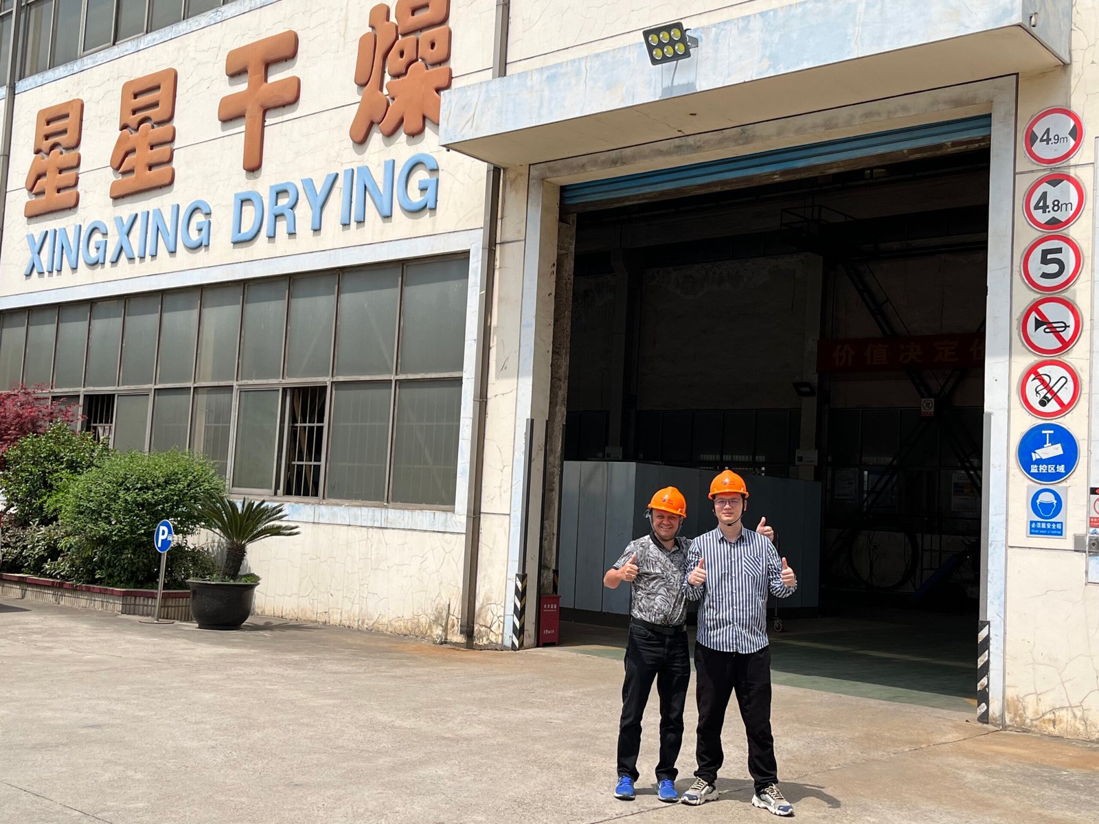 Brazilian wholesale partner reviewing rotary dryer specifications