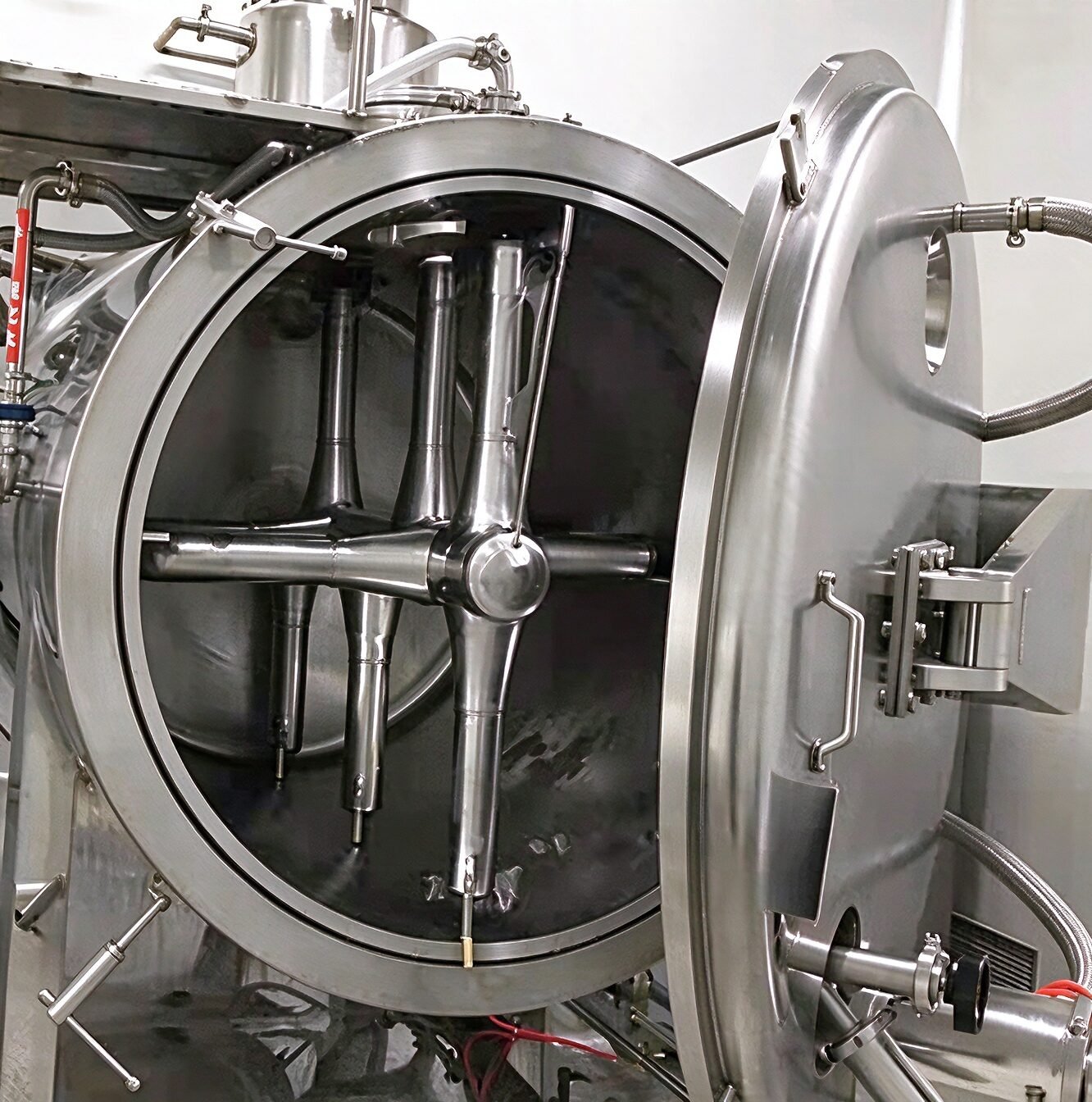Open door of vacuum rake dryer showing internal agitator and reachable surfaces